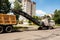 Road machinery removes old asphalt