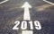 Road marking in form of 2019 year and arrow