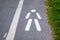 Road marking indicating an pedestrian walkway on a bicycle path