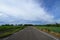 Road middle sugarcane field