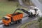 Road milling machine removes old asphalt