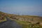 Road in the mountains. Electric iron poles in the mountains.