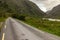 Road and mountains at Gap of Dunloe with rocks and vegetation