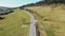 road in the mountains. tourist route in a beautiful area. Paved road and car moving on the road outside the city.