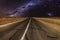 Road in the mountains under the Milky Way