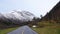 Road and Mountains in Valldola valley on Trollstigen route in snow in Norway