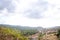 Road in the mountains. View from the mountain to the city