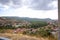 Road in the mountains. View from the mountain to the city