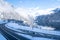 Road near the lake in the mountainous forest in the Alps