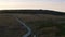 The road near the land in the evening.