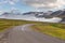 Road near Sedydisfjordur. Mountains in the background, East Iceland