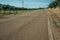 Road next to farm with olive trees