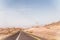 A road next to a mountainous desert landscape. Road 12 on the way to Eilat, Israel, on the Egyptian border. Mountains in