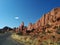 Road next to rounded rock formations in Arches National Park