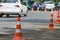 Road orange conical sign on the repair of the road in the city