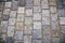 Road paved with paving stones. Cobbles background.