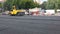 Road Paving. Workers laying stone mastic asphalt during street repairing works.