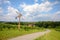 Road with a pinwheel Klapotetz through the vineyard, Southern Styria Austria