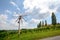 Road with a pinwheel Klapotetz through the vineyard, Southern Styria Austria