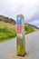 A road post with a direction indicator to the Pyg trail for climbing to Snowdon Peak