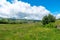 Road through private fenced green pastures