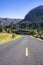 Road in the protected area of the Columbia River Gorge along the riverbank with mountains and trees