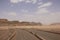 Road and red mountains of the canyon of Wadi Rum desert in Jordan. Wadi Rum also known as The Valley of the Moon in southern