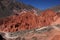 Road through red mountains in Pumamarca