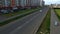 Road residential area with walking on sidewalk people. Scene. Top view of road with rare traffic and walking people in