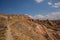 The road in the rocks in the Rose valley, Gulludere valley. In the distance White mountain, Aktepe hill. Cappadocia, Anatolia,