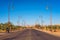 Road with row of stylish street lamps in the center of Ouarzazate, Morocco