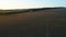 Road running through rural fields at dawn. Shot. Top view of beautiful rural landscape of dark farm fields at dawn. Top