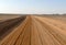 The road running through the Sahara desert.