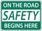 On The Road Safety Begins Here Sign On White Background