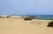 Road in sand dunes landscape of Corralejo National Park, Fuerteventura, Canary Islands, Spain