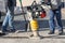 Road service workers use a vibratory rammer to repair a section of the road