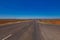 On the road side of the Stuart highway. Along the deserted barren vast landscape of the Australian outback. The grey red asphalt