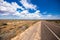 On the road side of the Stuart highway. Along the deserted barren vast landscape of the Australian outback. The grey red asphalt