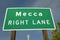 A road sign announcing you are in ï¿½Mecca,ï¿½ CA