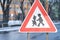 Road sign of attention to be close to school where can children