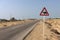 Road sign: Beware of camels.