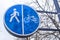 road sign blue circle with bike and figure of a man. cycling and walking paths