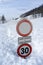 Road sign buried by snow