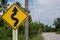 Road sign curved reminds the motorists and vehicles while driving with yellow sign reflecting light to be visible at night at the