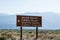 Road sign for Death Valley National Park points of interest - Scotty`s Castle, Eureka Valley and Saline Valley. No services on an