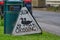 Road sign of ducks crossing road.