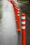 Road sign flexible plastic bollards with pedestrian white marking line and arrow sign on cement floor in parking car