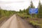 Road sign at gravel road Kolyma highway outback Russia
