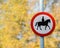 Road sign with horse