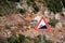 Road sign informing about steep rise on the mountain serpentine